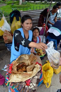 Buying some rocoto relleno in the main plaza at Urcos. 