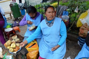 Selling rocoto relleno in the plaza at Urcos. 